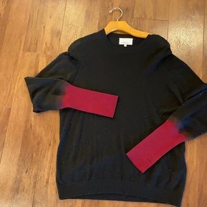 Blk to red ombré sleeves wool, cashmere, and silk sweater.